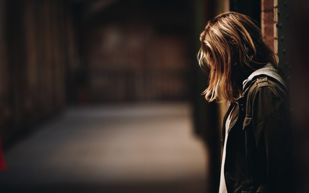 woman looking down and hair covering her face