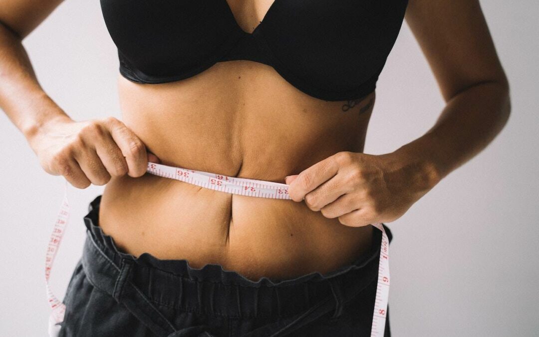 woman measuring waist