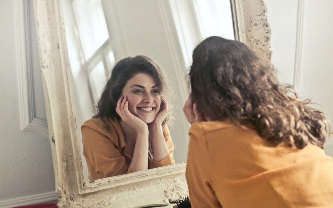 woman smiling in the mirror