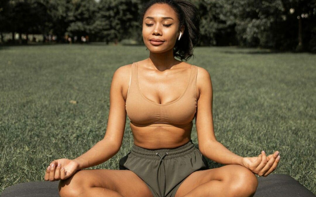 woman doing yoga at the park