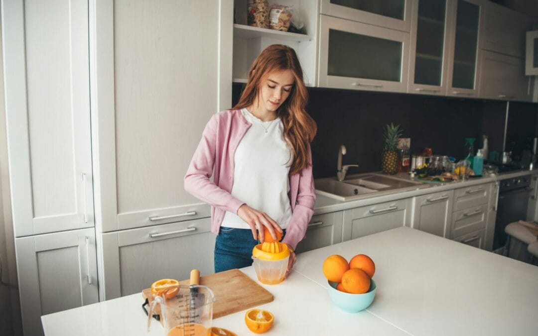 woman squeezing orange juice